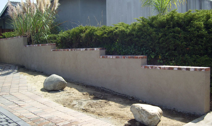 Plastered Block Wall with Brick Caps